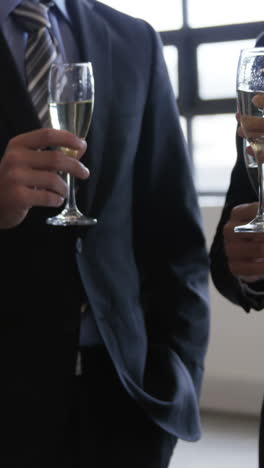 business people toasting with champagne