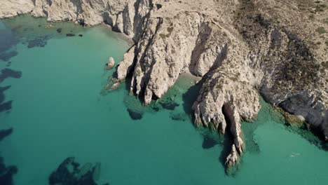 Exclusive-hidden-beach-cove-along-the-bright-blue-waters-of-the-Mediterranean