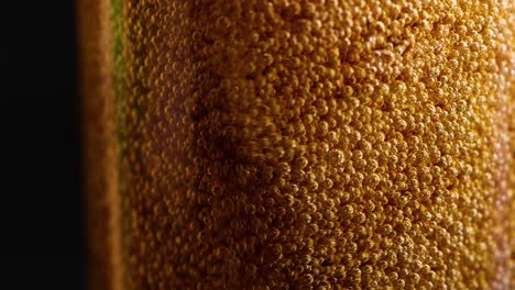 cola being poured, forming bubbles and foam