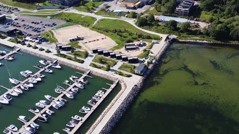 Pier-of-Haven-Kakumae-with-yachts-and-boats-in-Tallinn,-aerial-view