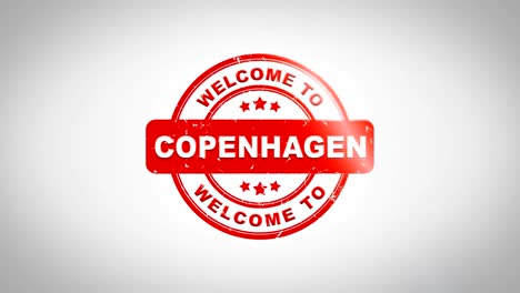 welcome to copenhagen signed stamping text wooden stamp animation. red ink on clean white paper surface background with green matte background included.