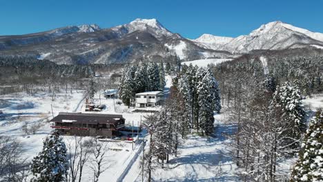 rising aerial view of mount myoko and akakura onsen ski resort