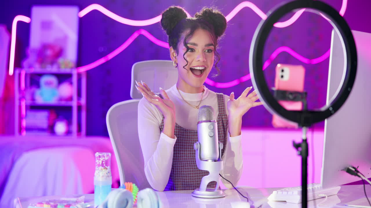 Woman recording a podcast in her home studio