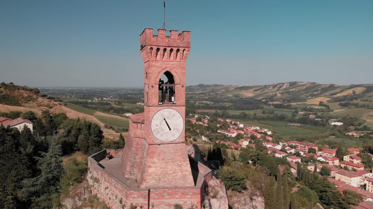 Drone flyby of the medieval clock tower. Brisighella, Emilia Romagna, Italy.