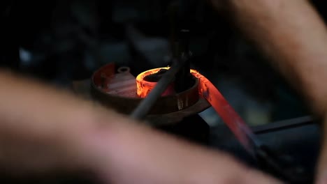 Blacksmith-shaping-the-molten-metal-4k