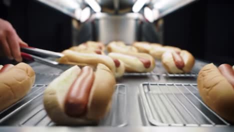 hot dogs being prepared
