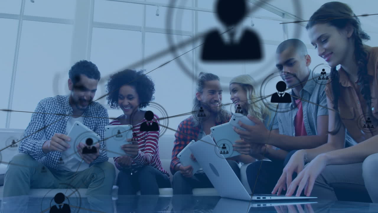 Animation of network of connections with people icons over diverse business people in office