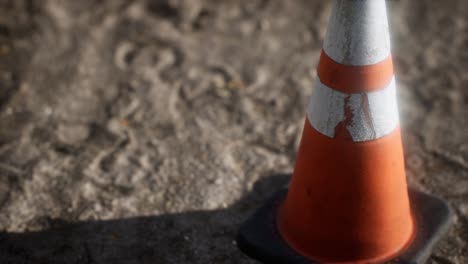 orange and white striped traffic cone