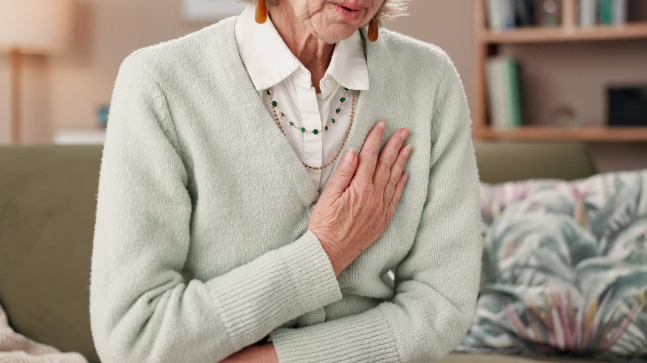 Elderly woman experiencing chest pain or heart attack