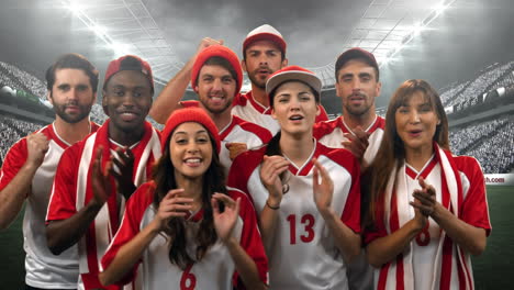 group of fans cheering for their team in a stadium