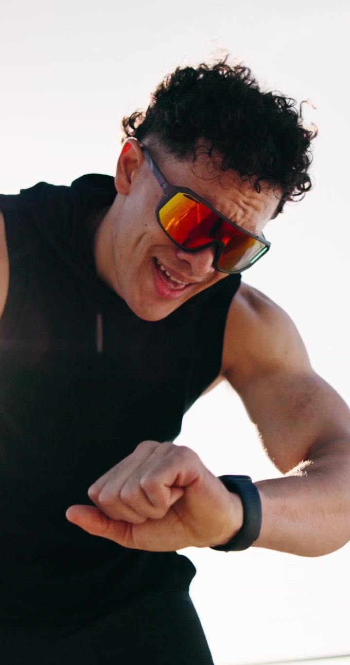 Athletic Man Checking Smartwatch After Outdoor Workout