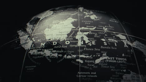 close-up view of a world globe, focusing on the indonesia region