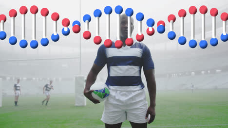 Animation-of-dna-strand-over-male-rugby-players-at-stadium