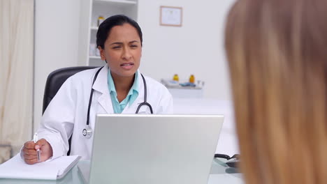 doctor questioning a patient