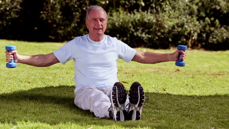 Mature-man-lifting-dumbbells-