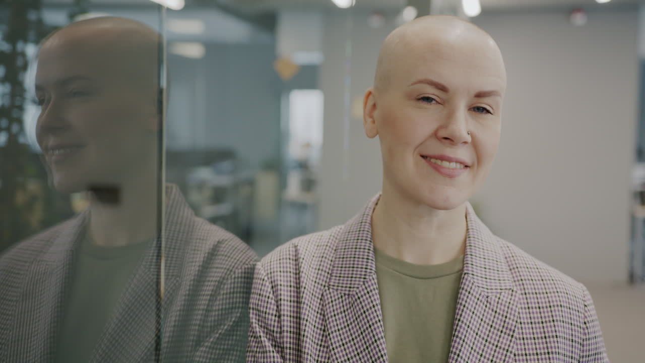 Confident Bald Woman in Office