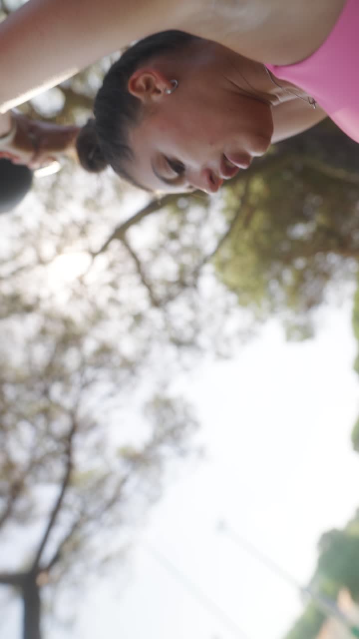 A person engaged in an outdoor kettlebell workout
