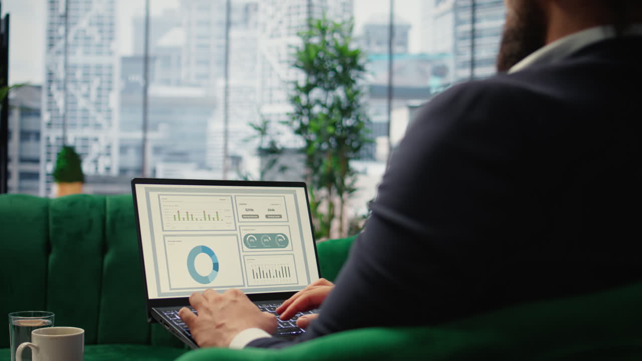 Vertical Video Confident leader reviews sales trends and budget reports in his smart office