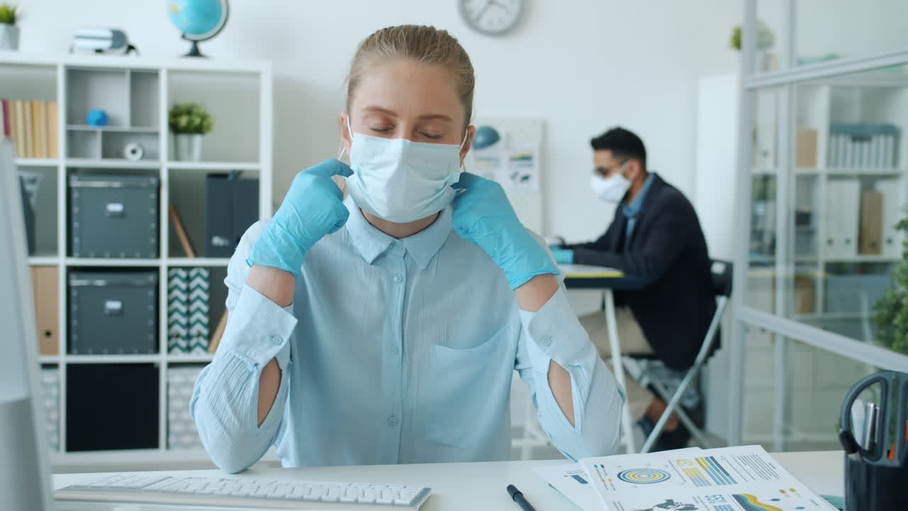 Woman and Man Working in Office During Pandemic