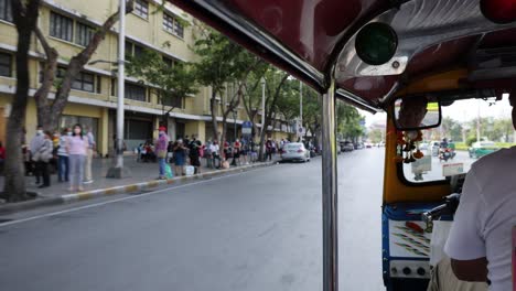 passenger's perspective of a city tuk-tuk journey