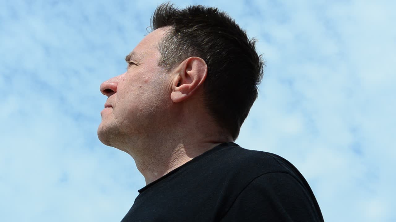 Man and sky. Man and clouds