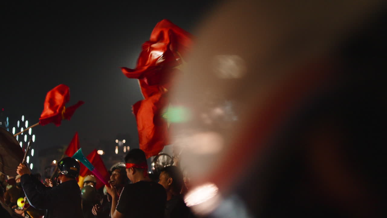 Crowd with Vietnamese Flags at Night