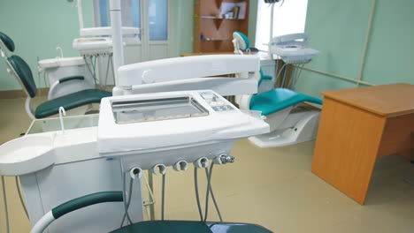 educational models of dentistry armchairs in the medical school classroom. stomatology chairs alongside with usual desks and chairs.