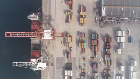 cargo containers and moving trucks in a sea port