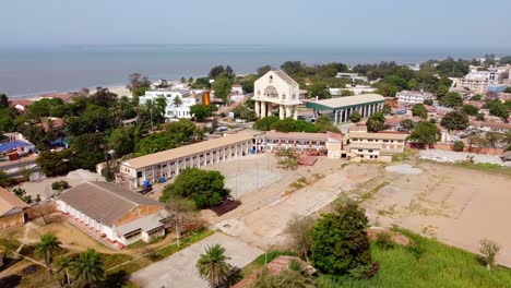 Aerial-drone-view-of-Banjul-flying-towards-Arch-22-in-Banjul,-The-Gambia