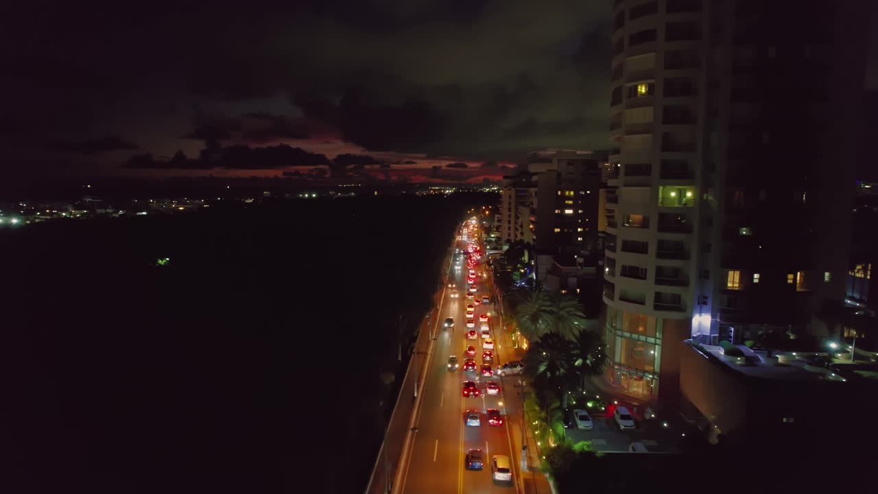 Aerial over Anacaona Avenue Traffic after Sunset in Santo Domingo