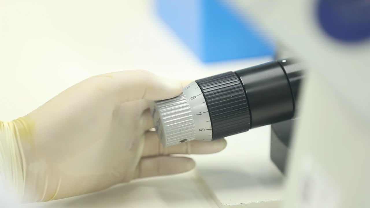 Scientist woman medicine Development Laboratory Using Microscope, Analyzes Petri Dish Sample for disease experiment, medical study and dna process. Researcher, biotech and molecule exam of engineering