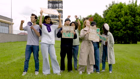 group of  people in a protest with megaphones and placards 2