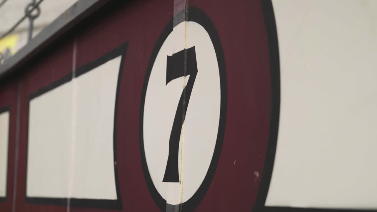 Beautiful slow motion shot with zoom of the number 7 stands of the Las Ventas bullring in Madrid during the day.