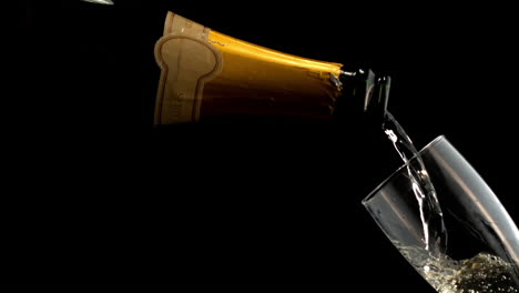 bottle filling champagne flute