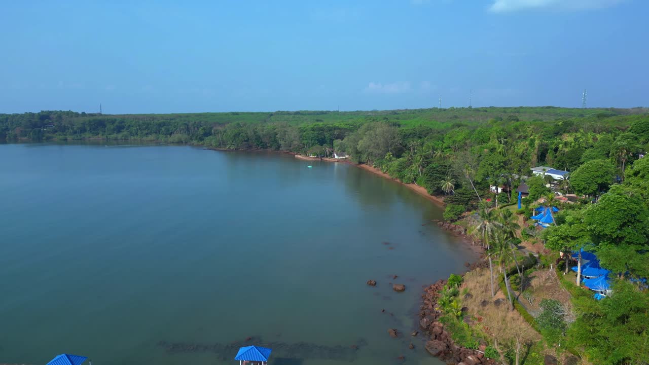Small fishing boat floating near tropical coast of Koh Mak island, Thailand. Breathtaking aerial view flight pull in drone