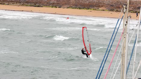 windsurfer performing tricks on the water