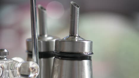 close-up of metal oil dispensers