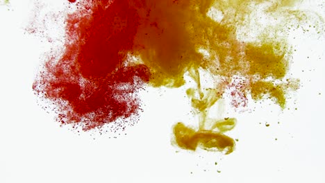 4k footage of colorful ink drops in water, isolated abstract background. pouring ink in water. underwater paint mix. slow psychedelic dye swirls, colored smoke explosion. splashing, floating liquid