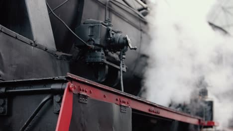 vintage steam train locomotive. pair locomotive train leaking smoke, steam ignited from behind.