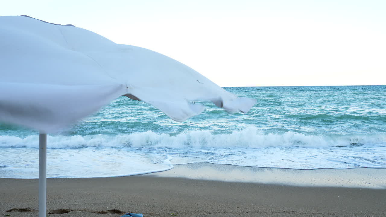Beach umbrella in the wind