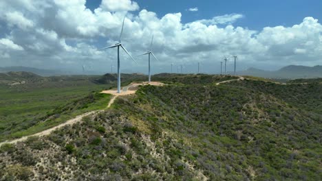 Row-of-wind-turbine-windmill-in-Dominican-Republic-and-cloudy-sky