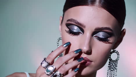 glamorous woman with dramatic makeup and jewelry