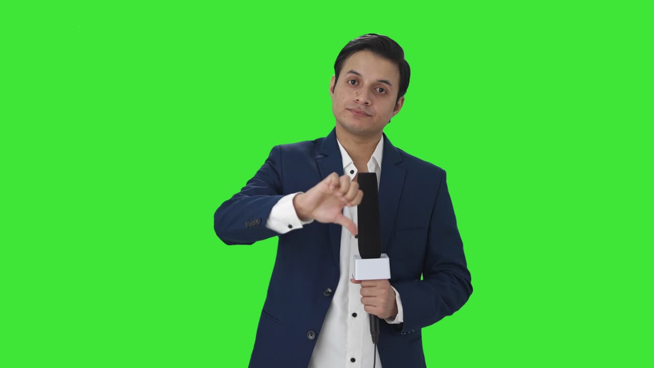 Disappointed Indian reporter showing thumbs down Green screen
