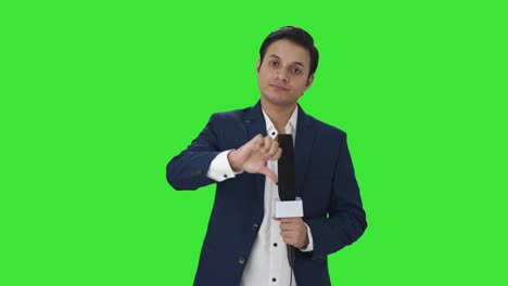 Disappointed-Indian-reporter-showing-thumbs-down-Green-screen