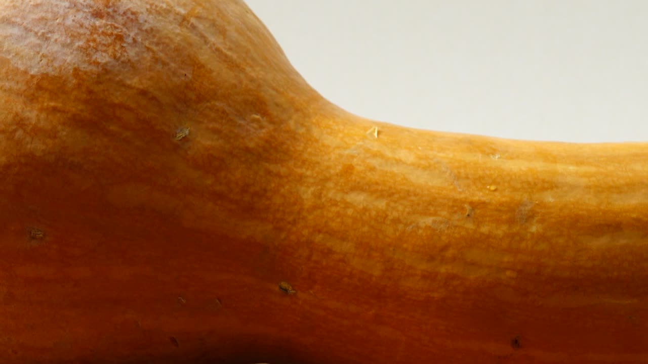 Pumpkin on a kitchen board. Shooting in the movement