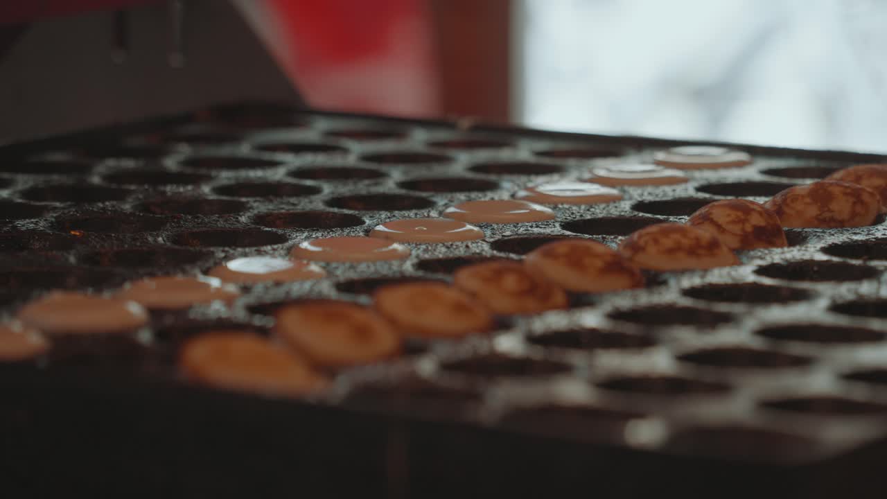 Close-up of Poffertjes Being Made