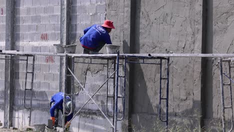 worker climbs down a scaffold structure safely.