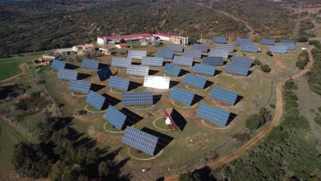 a sprawling solar power plant in lleida, catalonia, with vast arrays of panels, aerial view