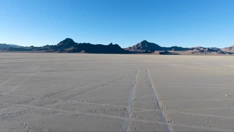 flying over the bonneville salt flats in northwestern utah reveal white salt and tire tracks