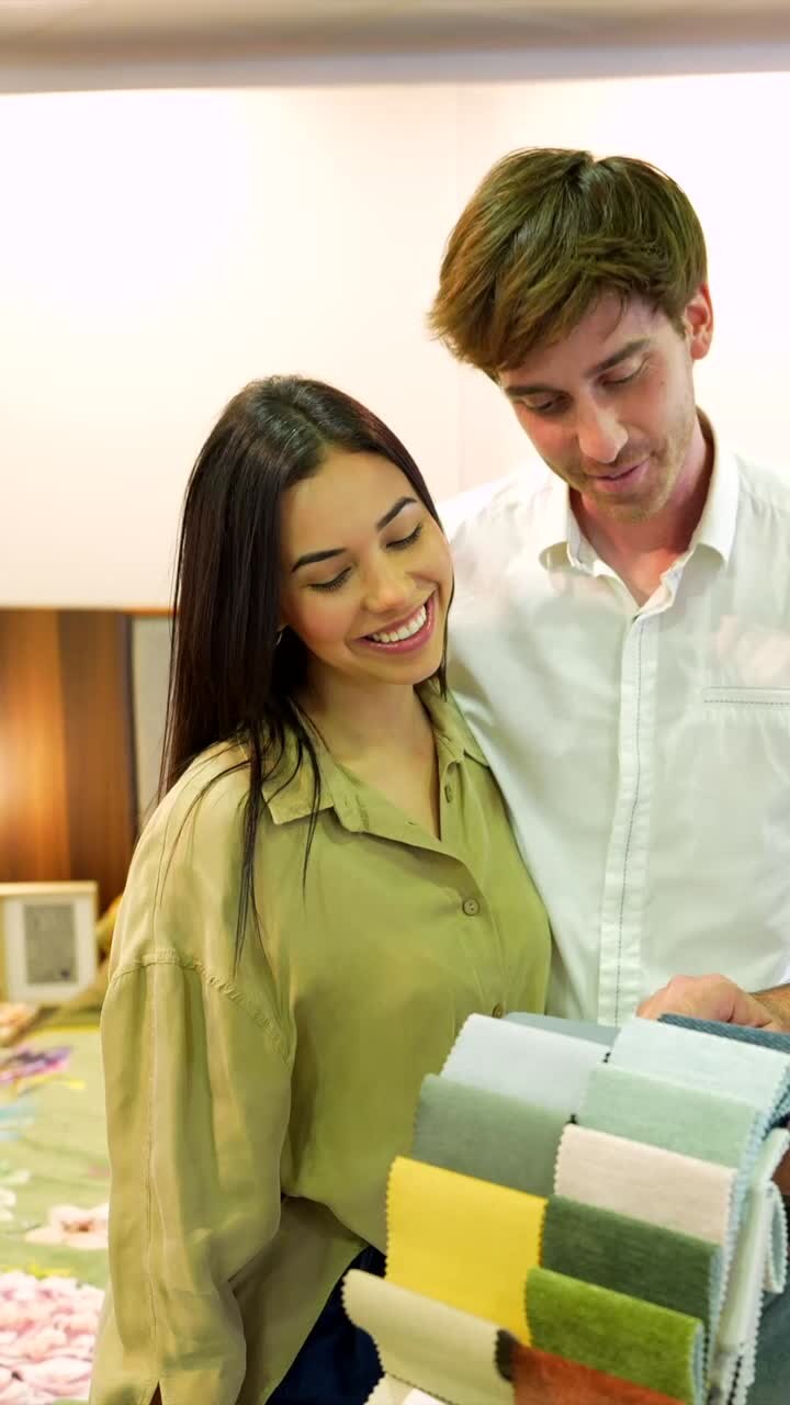 People looking at fabric swatches